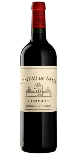 A bottle of Château de Sales Pomerol red wine, featuring a dark glass bottle with a cream-colored label and a red foil seal at the top, isolated on a white background. By Whelehans Wines. 