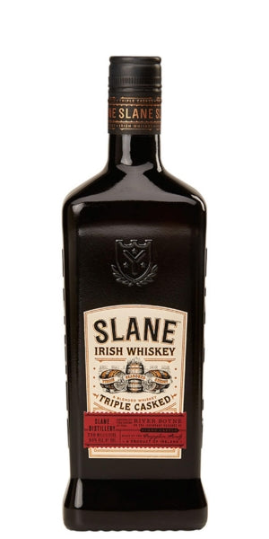 A bottle of Slane Irish Whiskey Triple Cask on a plain white background. By Whelehans Wines